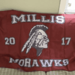 Millis mohawks flag laying on a couch